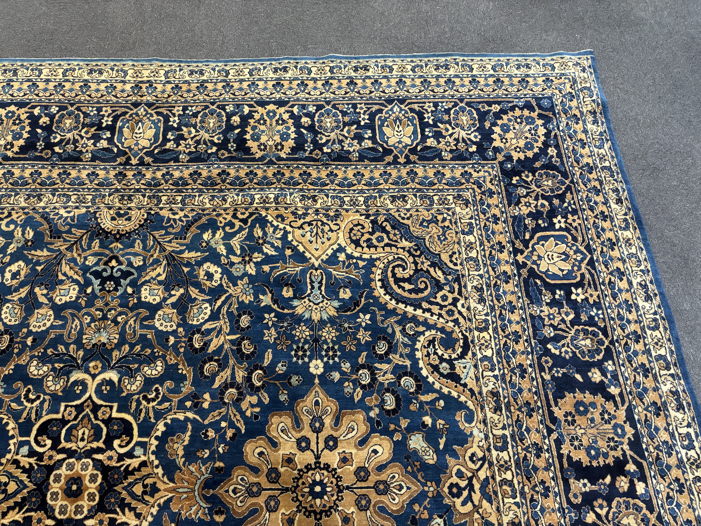 An early 20th century Kirman blue ground carpet, 425 x 325cm